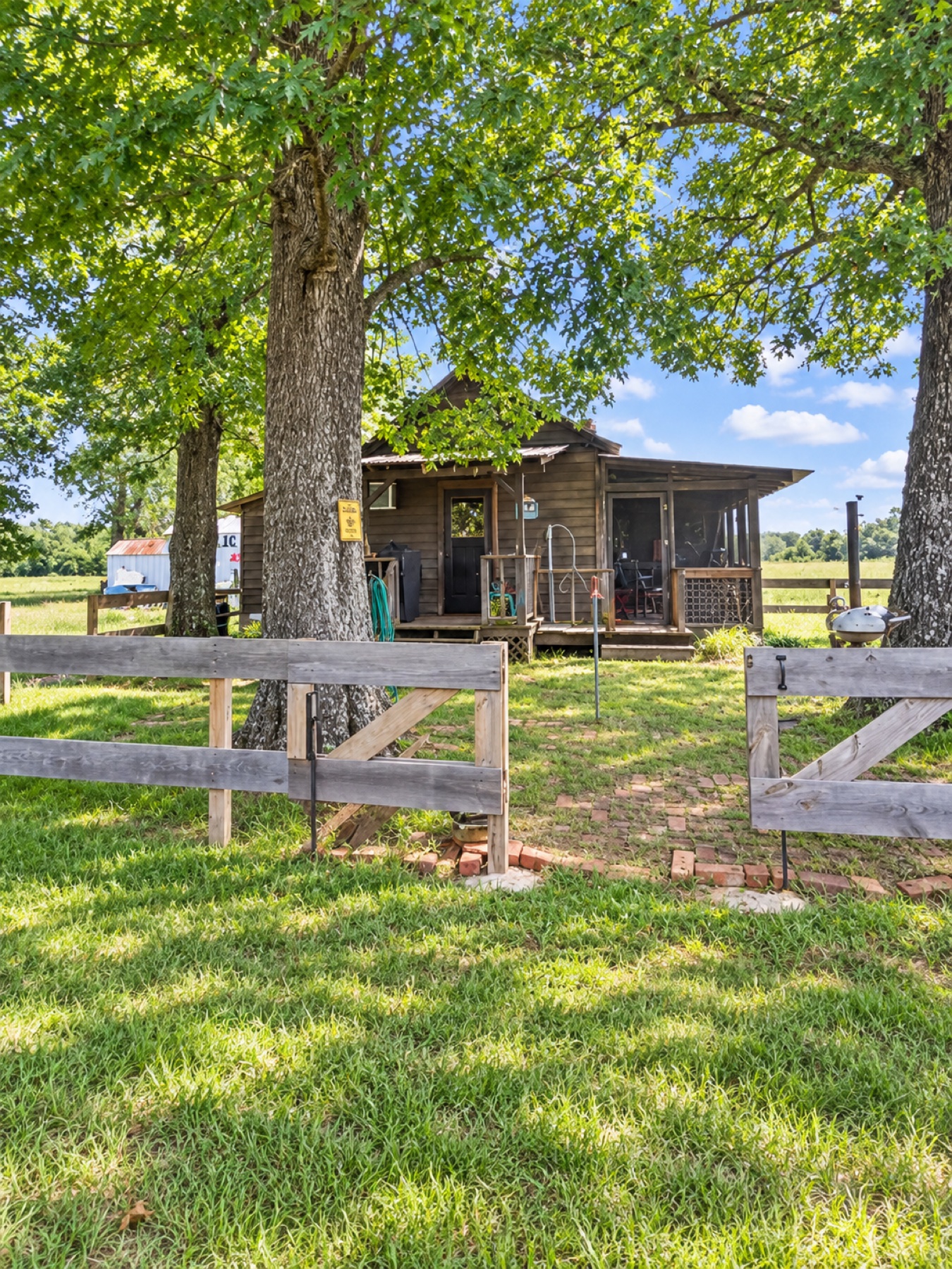 Shaded entrance and screened porch of the 1930 ranch cabin